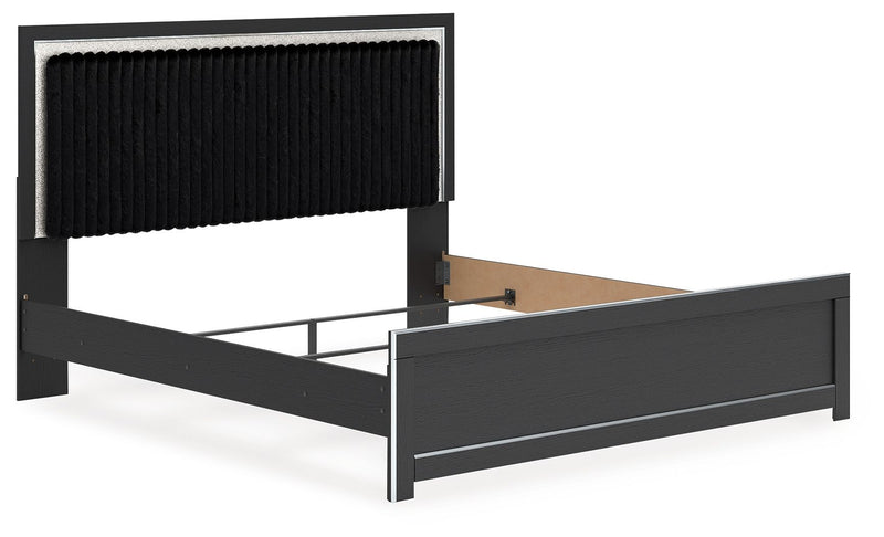Upholstered panel bed with dark frame and black upholstered headboard, front view with open space.