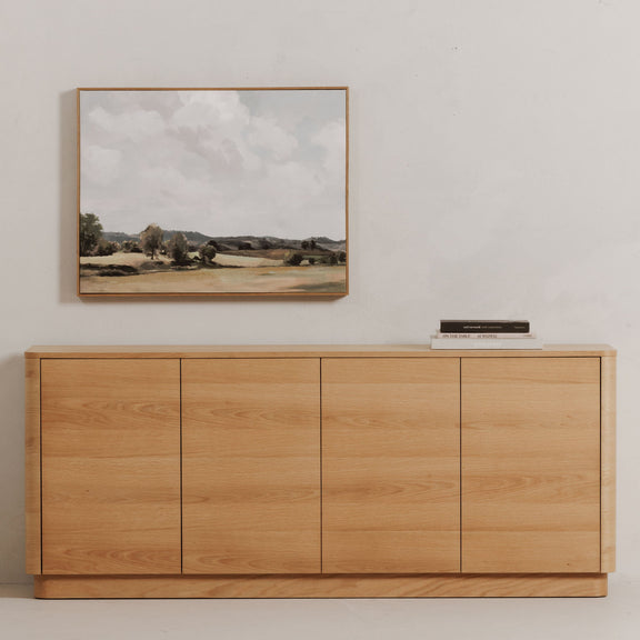 Light brown oak sideboard with four flat-panel doors and low profile