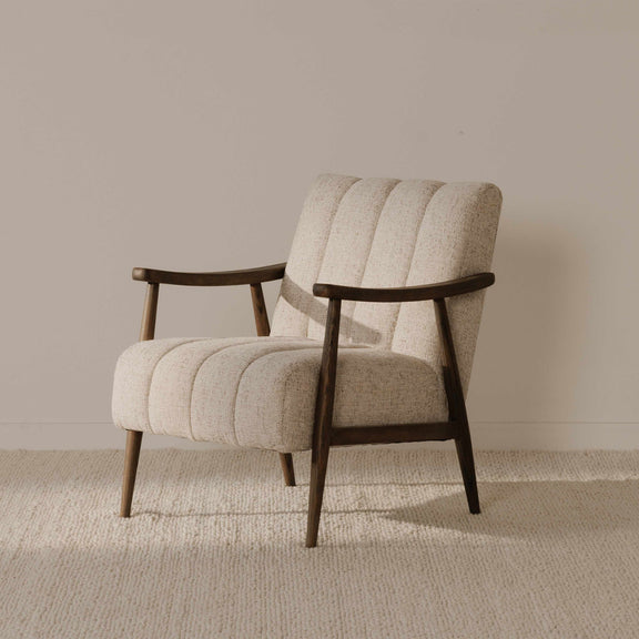 Light beige upholstered accent chair with curved wood arms and back