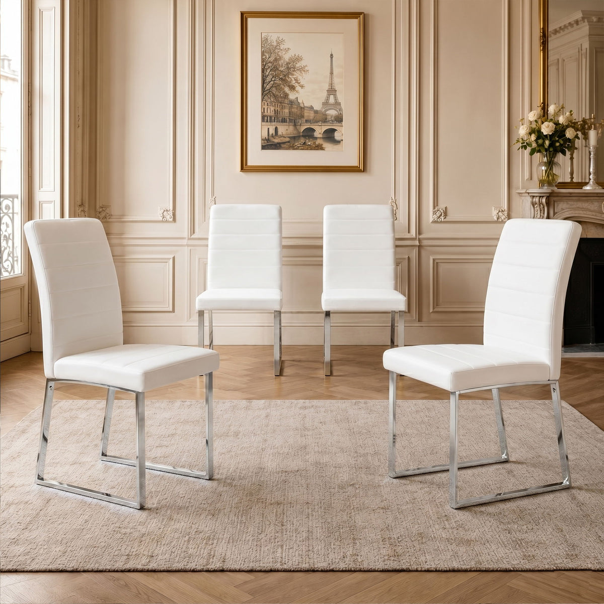 White upholstered dining chairs set with curved backs and padded seats on metal legs