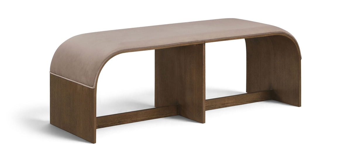 Beige upholstered velvet bench with curved end panels and open center frame
