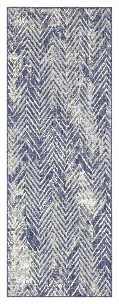 Indoor/outdoor area rug with blue and cream chevron pattern, thin border edges.