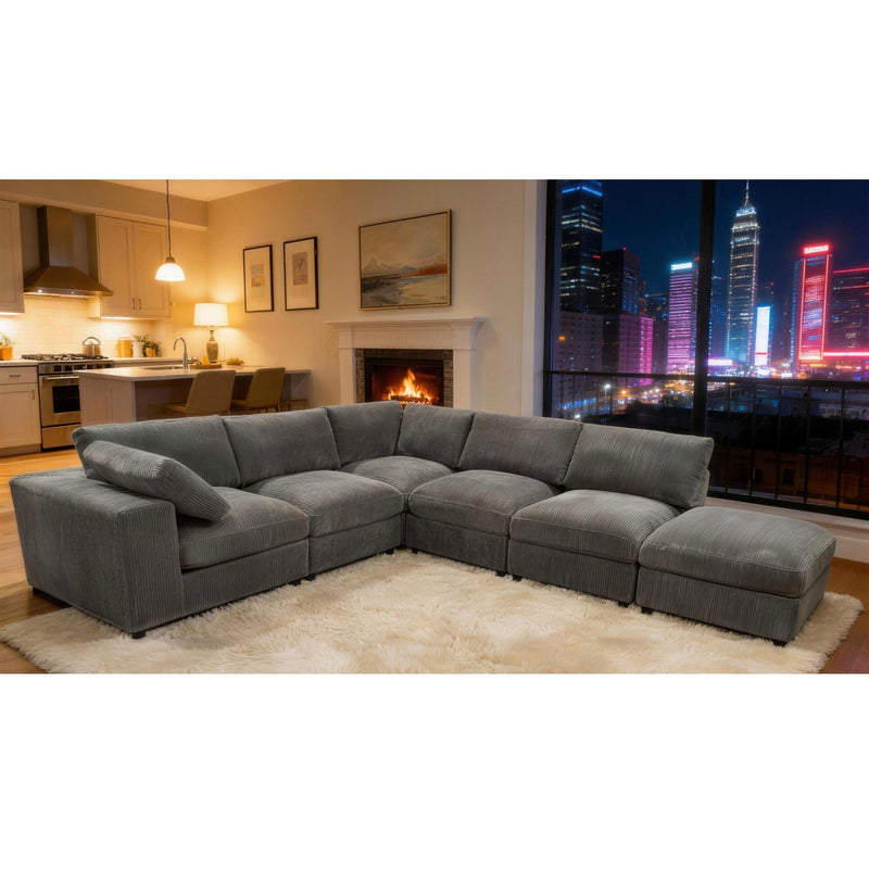 Gray modular sectional sofa with chaise lounge and ottoman