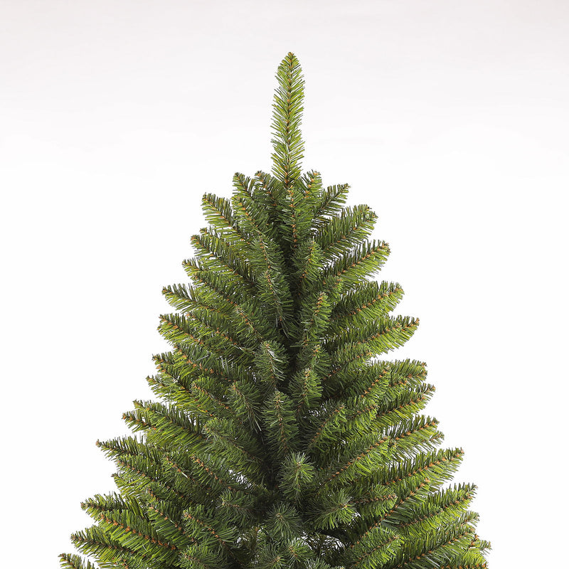 Dark green artificial Christmas tree close-up showing layered branch tips