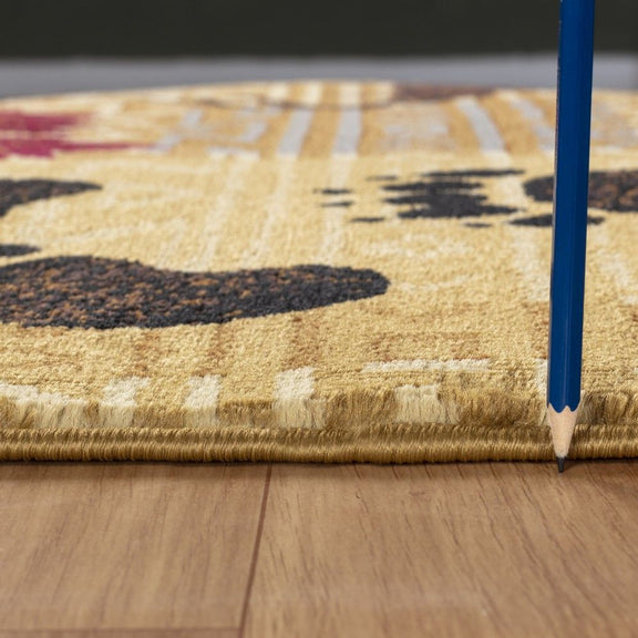 Close-up beige rug pile and border trim with animal silhouettes and geometric design
