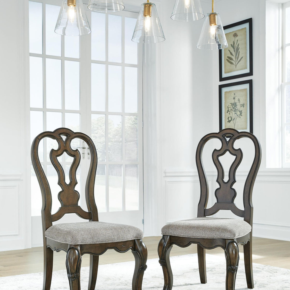 Set of 2 Maylee dining side chairs with dark brown carved backs and gray upholstered seats
