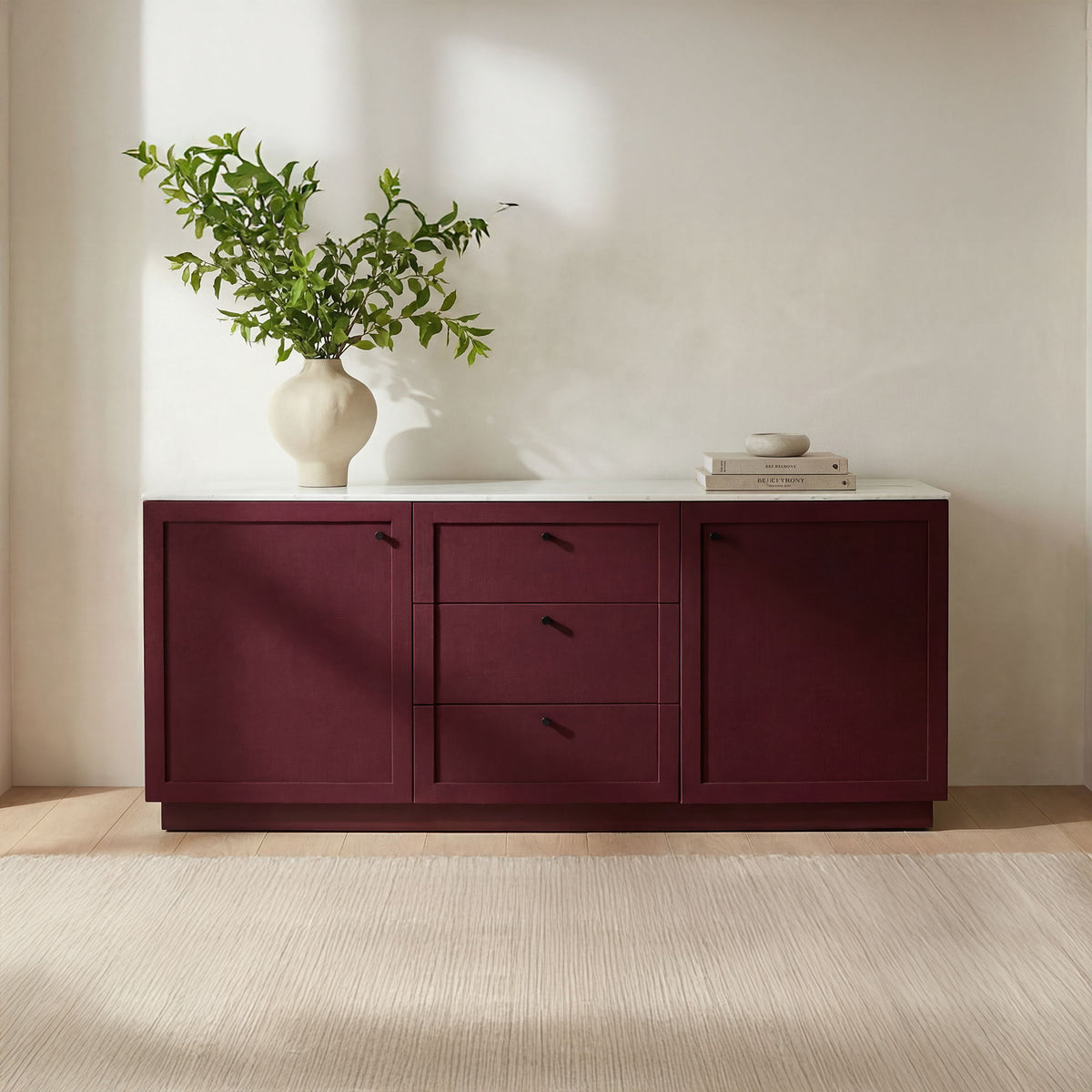 Deep burgundy sideboard with white top, two drawers and two cabinet doors