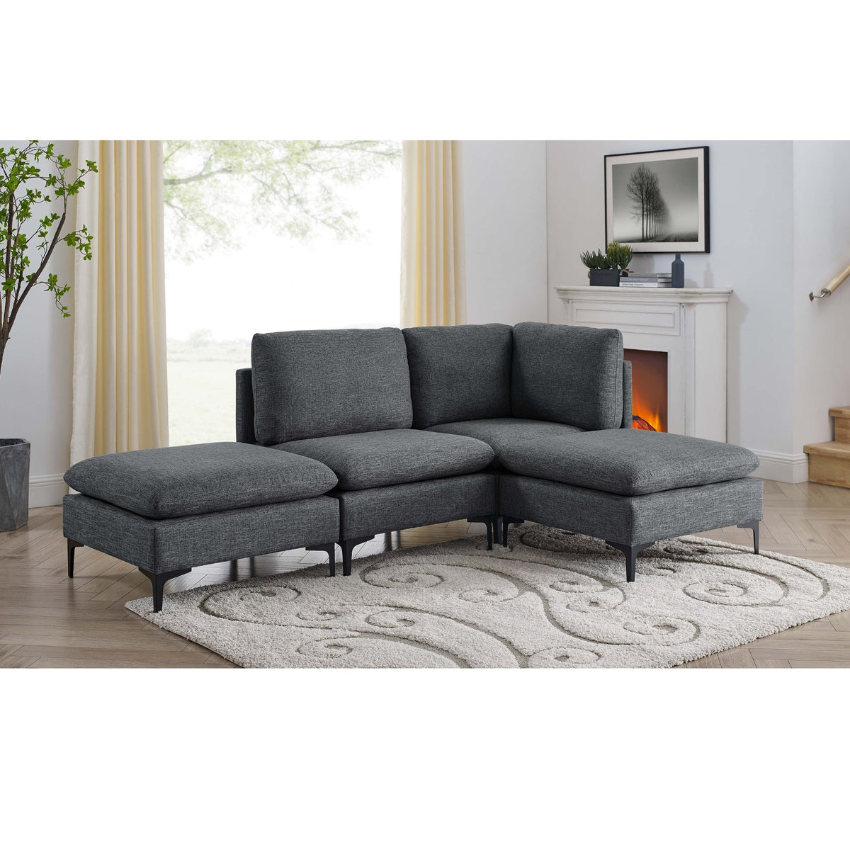 Dark gray upholstered modular sectional with tall legs and chaise ottomans, medium-firm seat