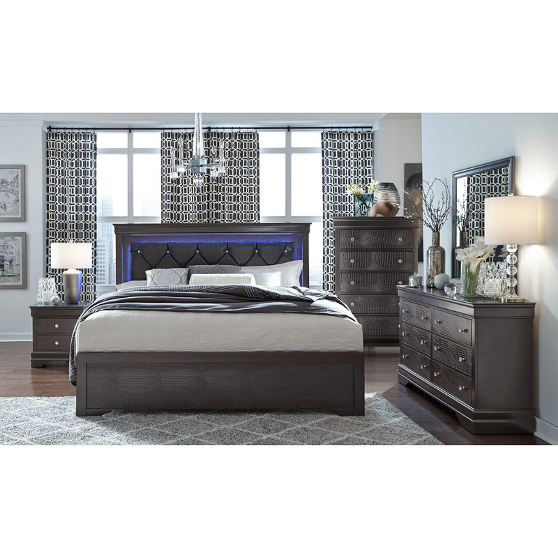 Bedroom set with dark upholstered bed and matching storage dresser with drawers