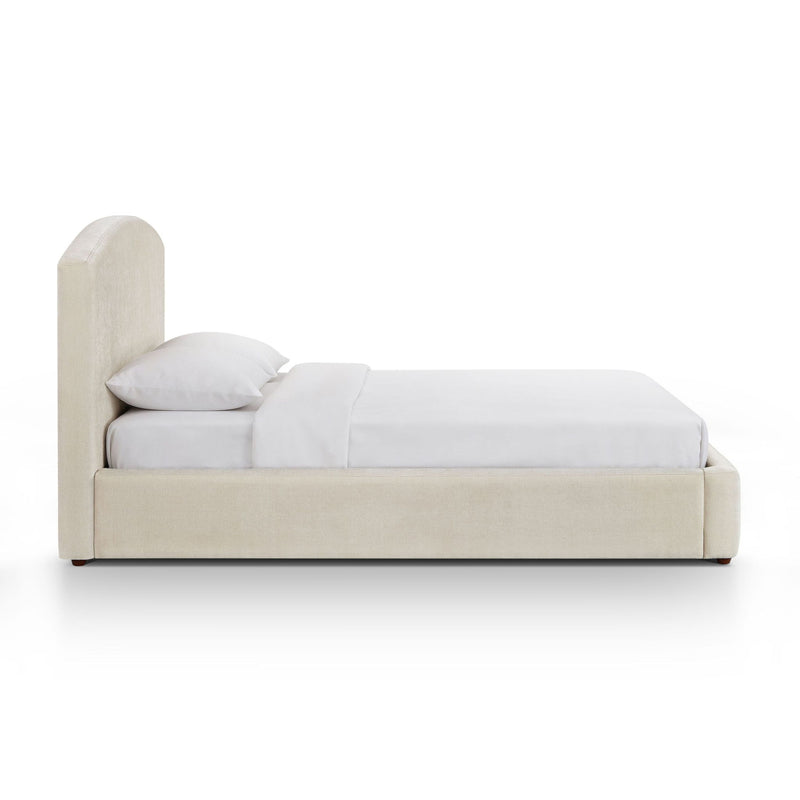 Upholstered platform bed with arched headboard, cream frame, white bedding set.