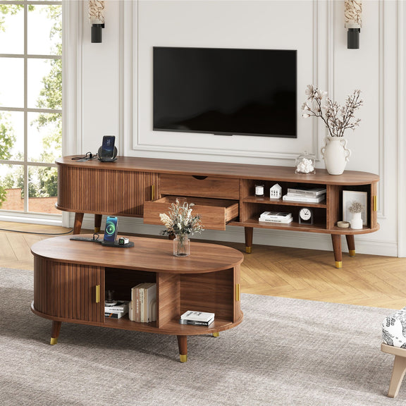 Wood TV stand with multiple shelves and drawers, paired with round coffee table