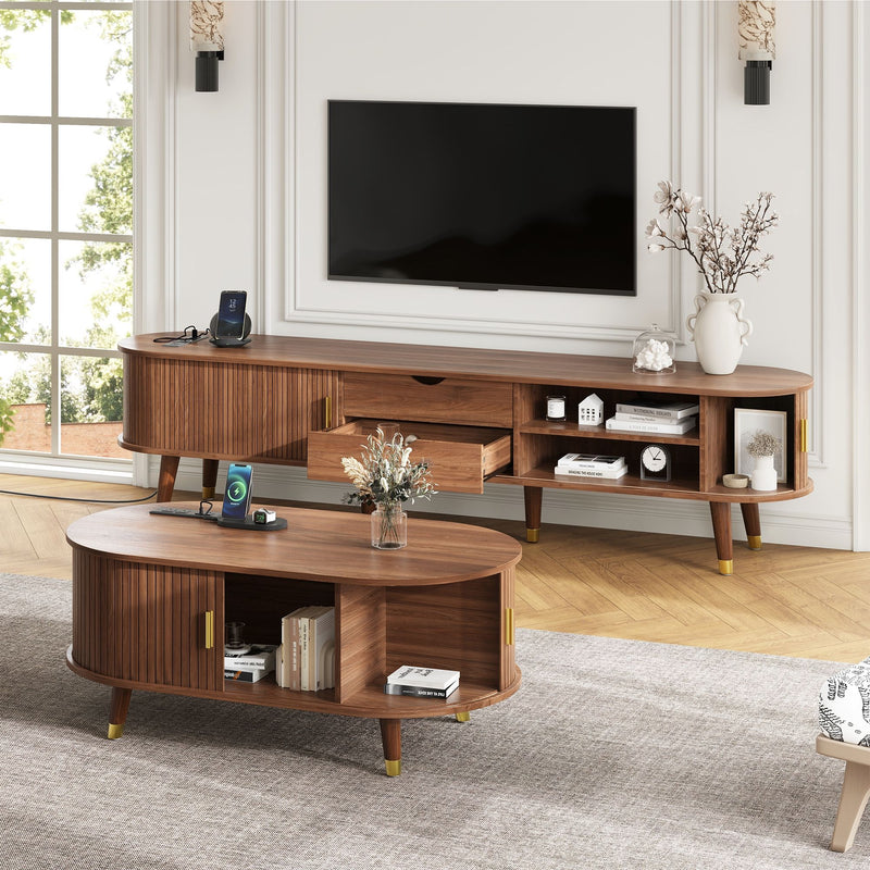 Wood TV stand with multiple shelves and drawers, paired with round coffee table