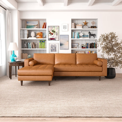 Orange corner sectional sofa with left chaise, tufted cushions and rounded armrests.