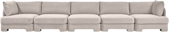 Gray velvet upholstered sectional sofa with clean-lined modular seating and back pillows