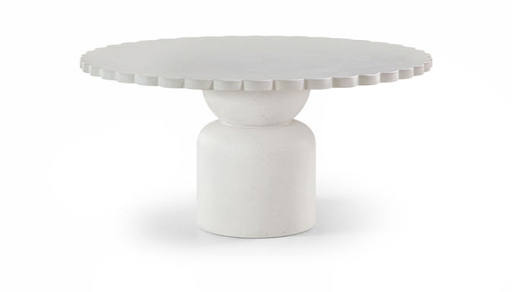 Round indoor/outdoor table with textured round top and pedestal base in light white.