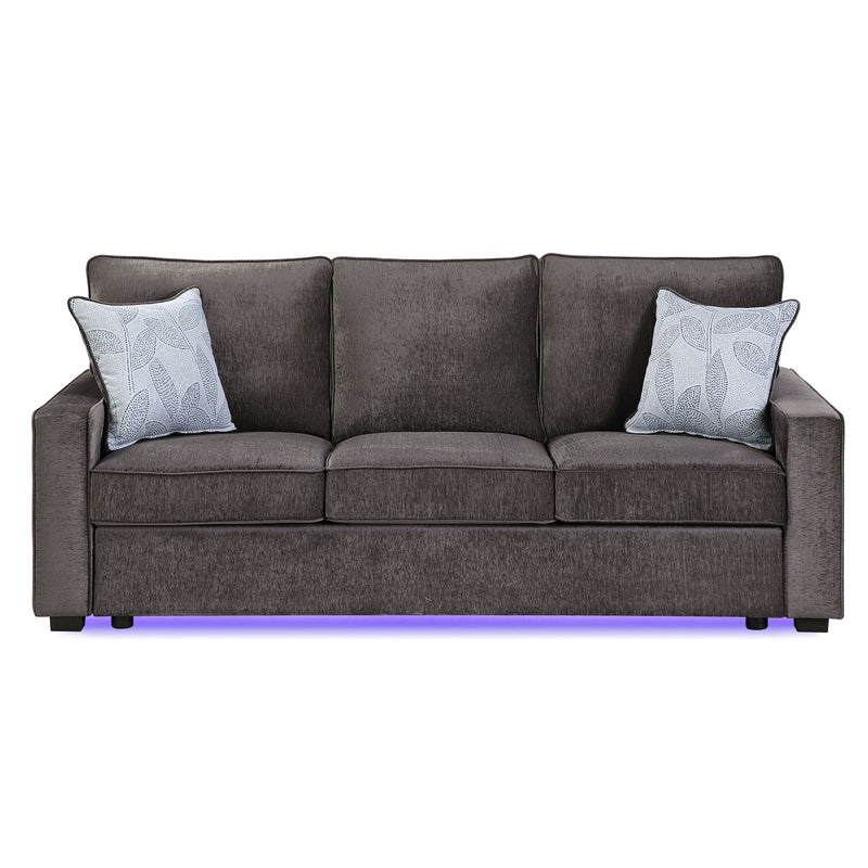 Dark gray upholstered 3-seat sofa with 2 patterned throw pillows and LED base light