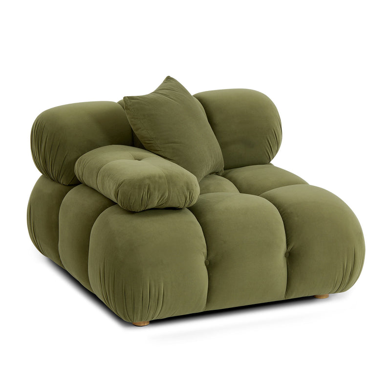 Green modular corner chair angled view with curved back cushions and bolstered arms.