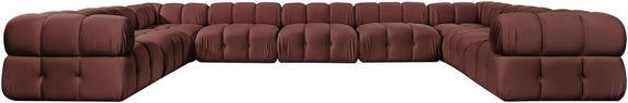Dark red velvet sectional with tufted seat cushions and curved corner arms
