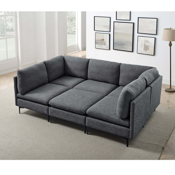 Dark gray modular sectional sofa with tall legs, corner chaise and rounded armrests