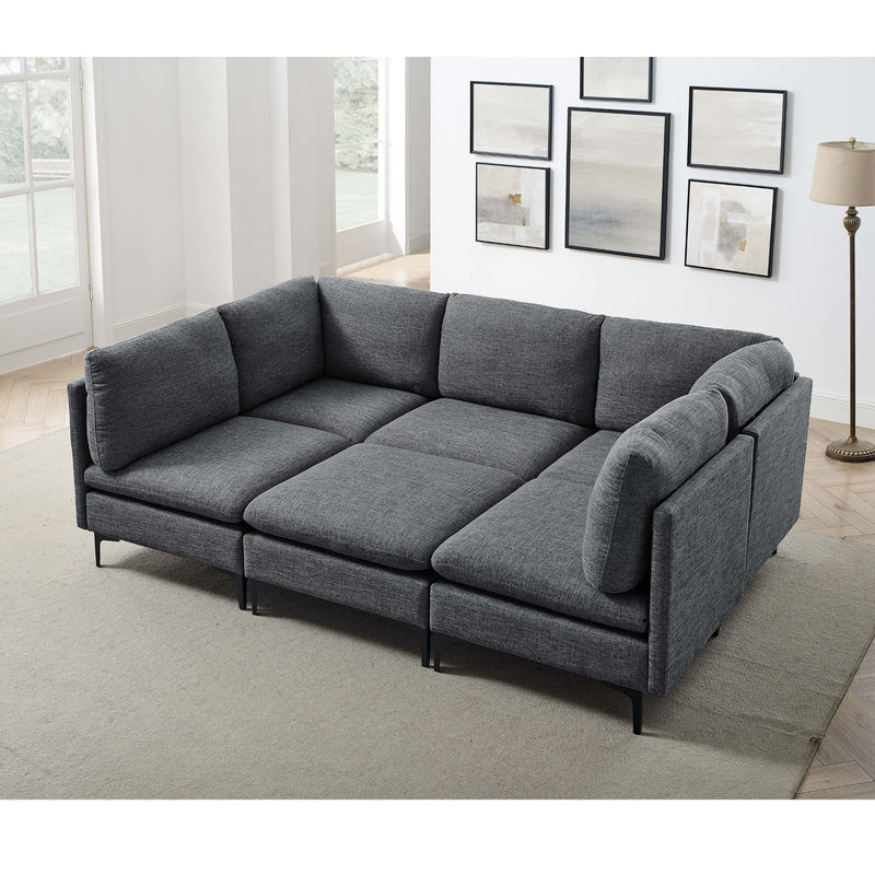 Dark gray modular sectional sofa with tall legs, corner chaise and rounded armrests