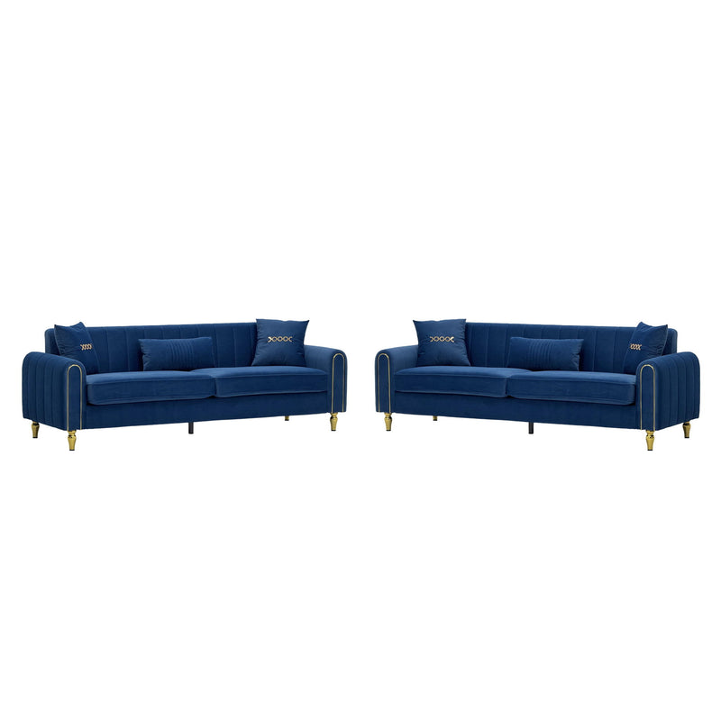 Two blue three-seat sofas with channel-tufted arms, cushions, and gold-tone feet