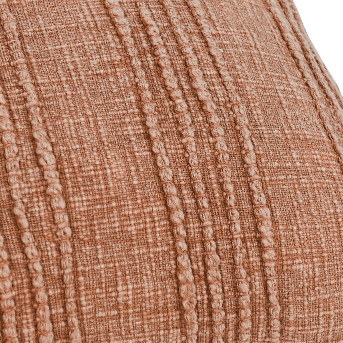 Close-up of terracotta-brown woven fabric with raised vertical texture