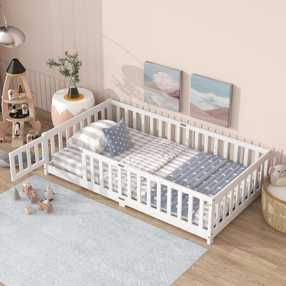Twin size floor bed with white safety guardrails and fence style sides