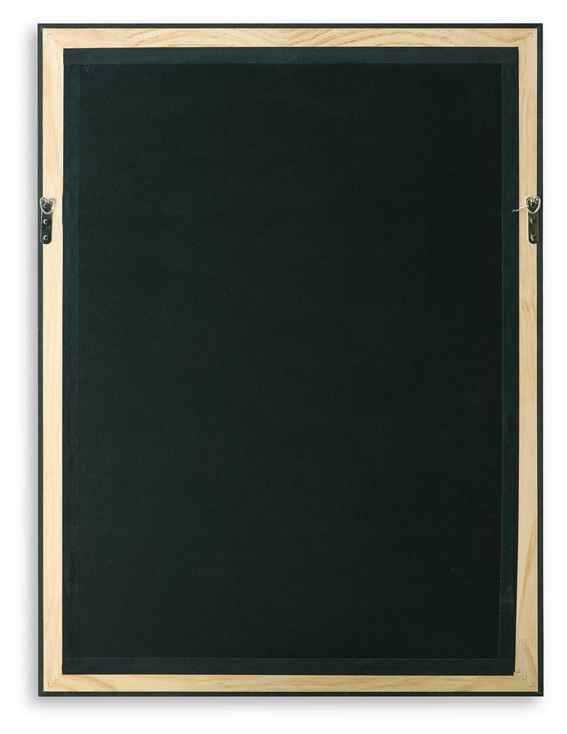 Framed wall art back panel with black surface and gold-toned mounting hardware