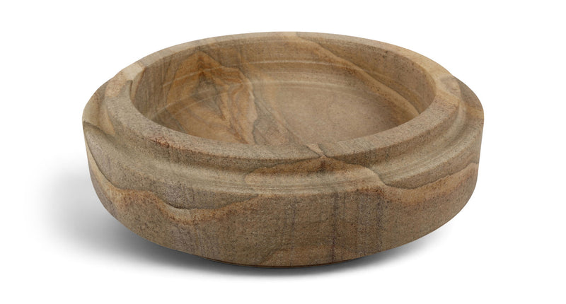 Light brown sandstone bowl with swirling stone grain, round low profile.