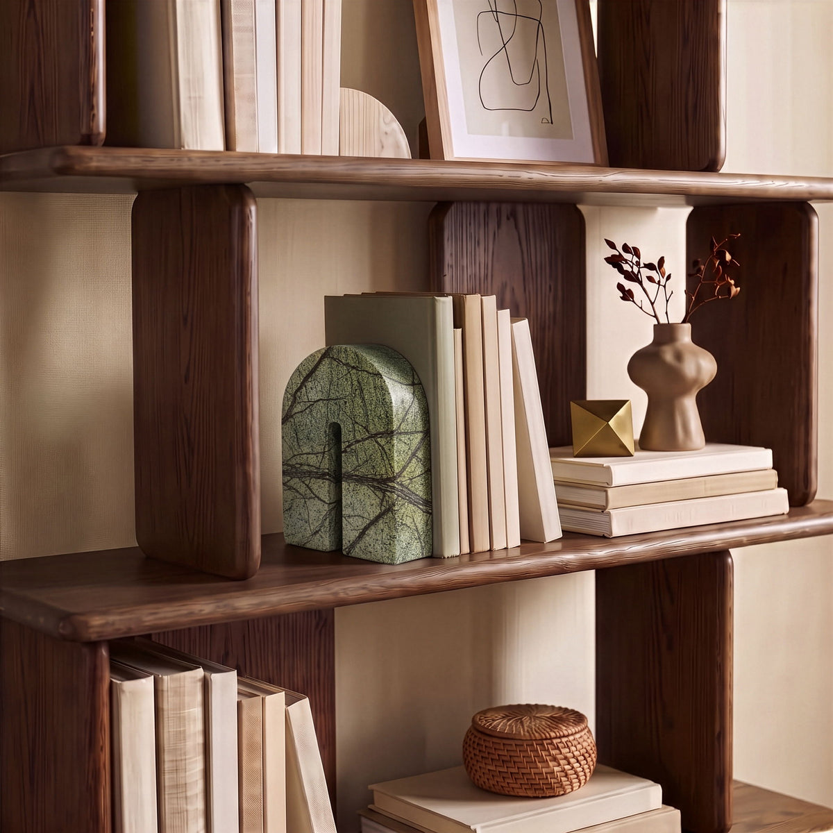 Green marble bookend with arched silhouette and dark web-like veining