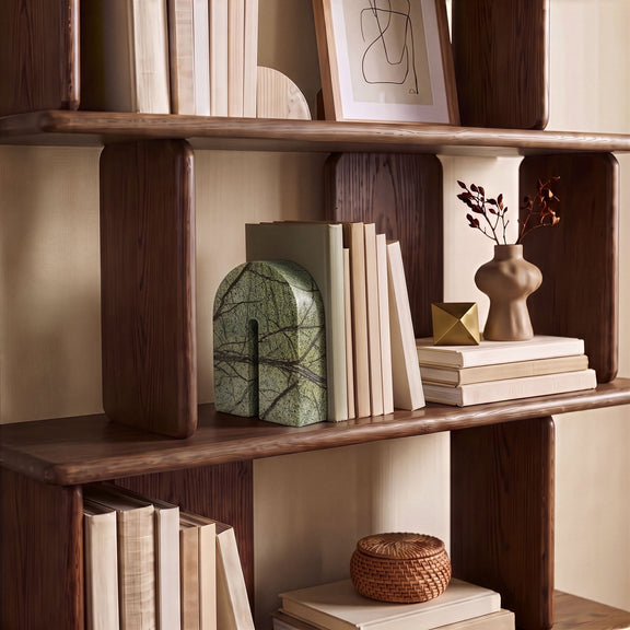Green marble bookend with arched silhouette and dark web-like veining