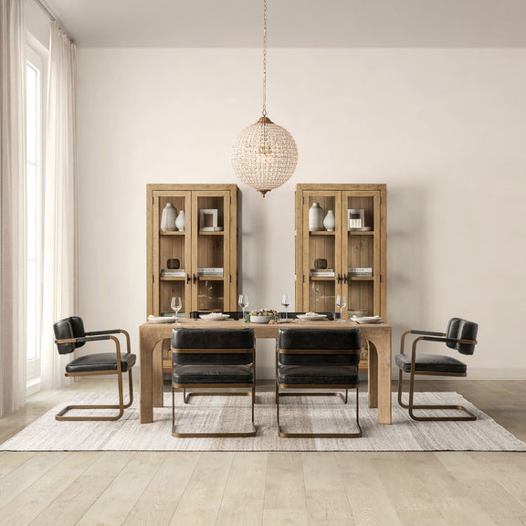 Warm natural wood dining table with upholstered chairs and matching server