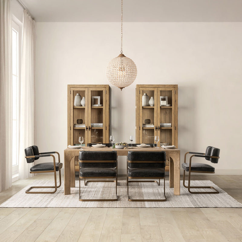 Warm natural wood dining table with upholstered chairs and matching server
