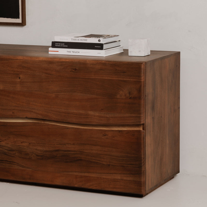 Brown wood 4-drawer dresser side view with recessed drawer pulls