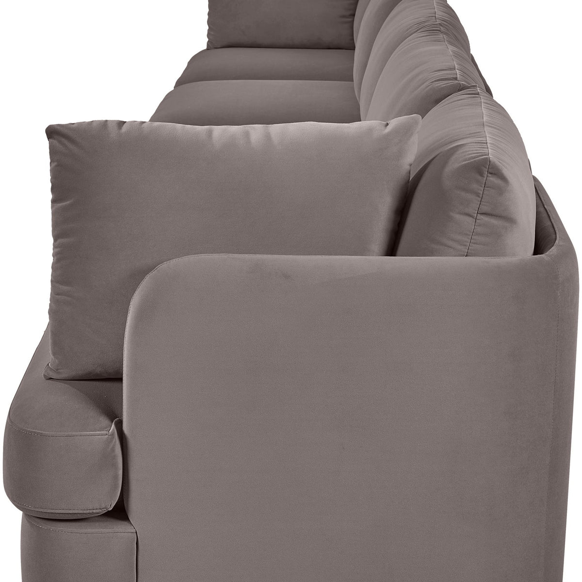 Gray velvet upholstered accent sofa chair with rounded arms and three back pillows