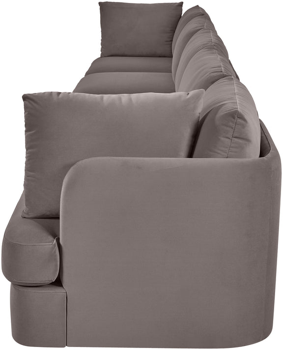 Gray velvet upholstered accent sofa chair with rounded arms and three back pillows