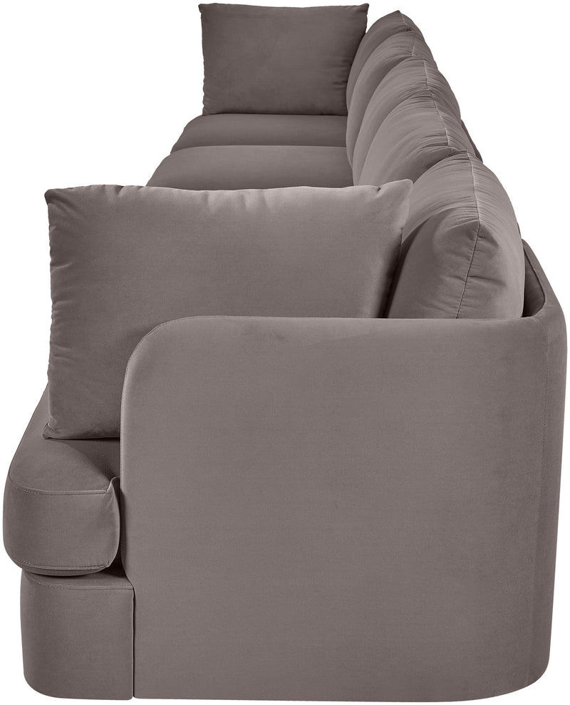 Gray velvet upholstered accent sofa chair with rounded arms and three back pillows