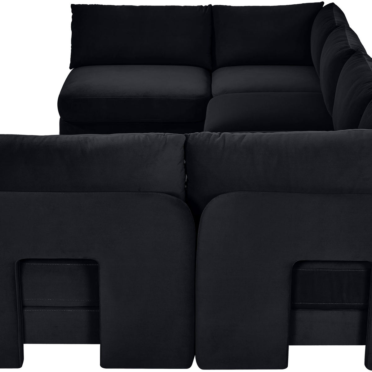Black velvet armless sectional sofa detail with squared seat and back panels