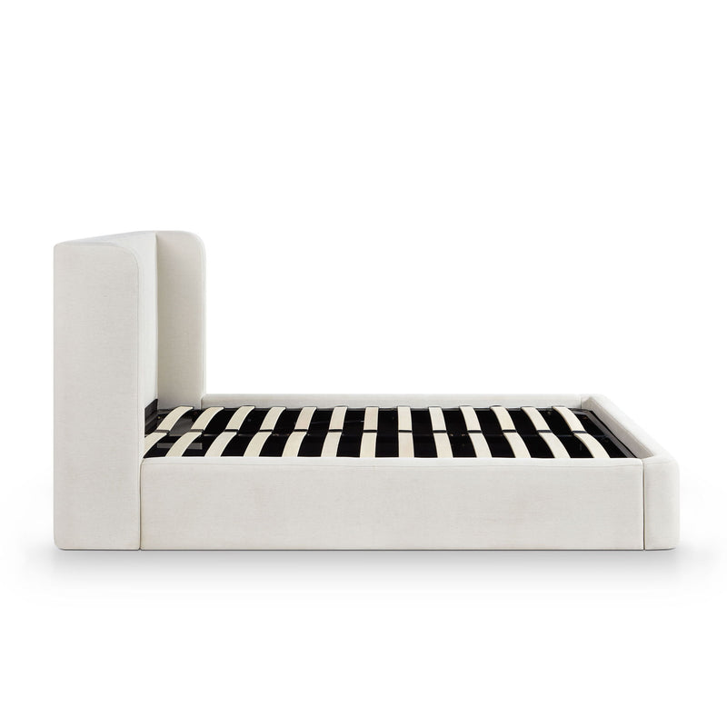 Upholstered platform bed with tall headboard, white frame and black-and-white striped slats