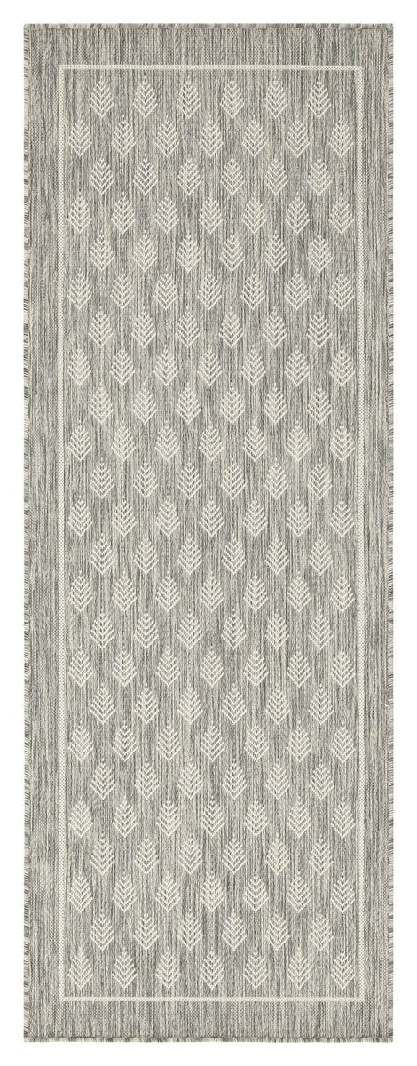 Light gray indoor/outdoor area rug with repeating diamond pattern and fringe edge