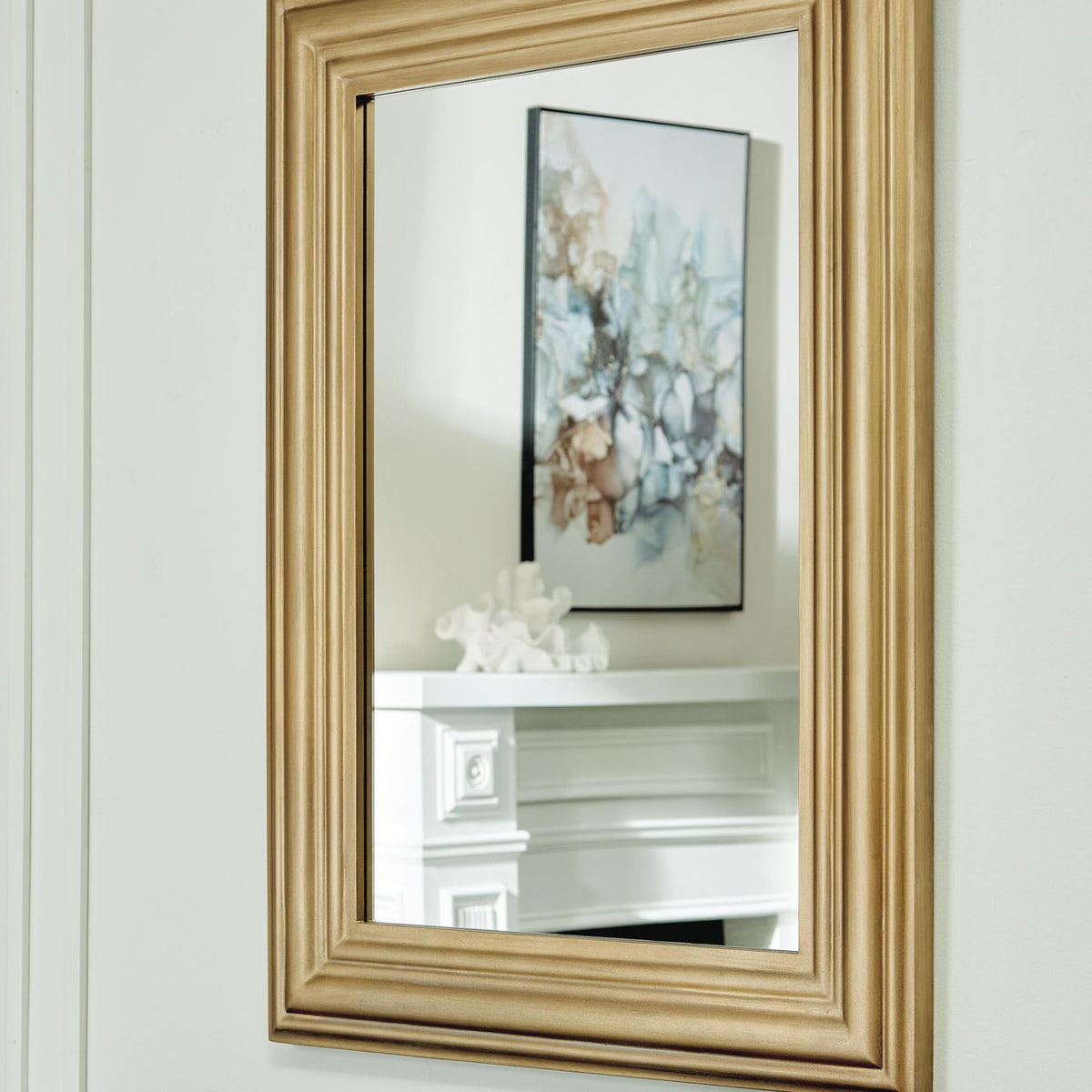 Keneriah gold accent mirror with ornate rectangular frame, wall-mounted style