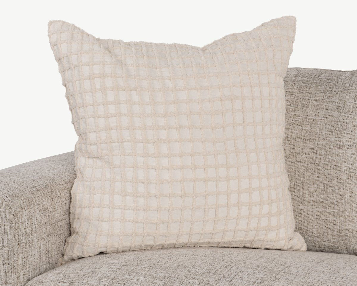 Ivory throw pillow with woven grid texture and subtle ruffled seam