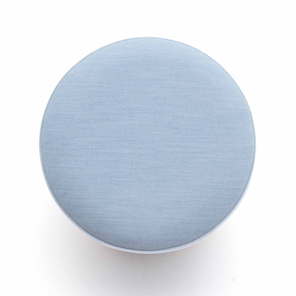 Light blue round ottoman top view, upholstered fabric surface