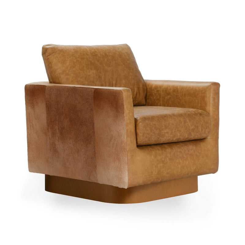 Brown leather accent chair, corner angle showing wide arms and tufted look