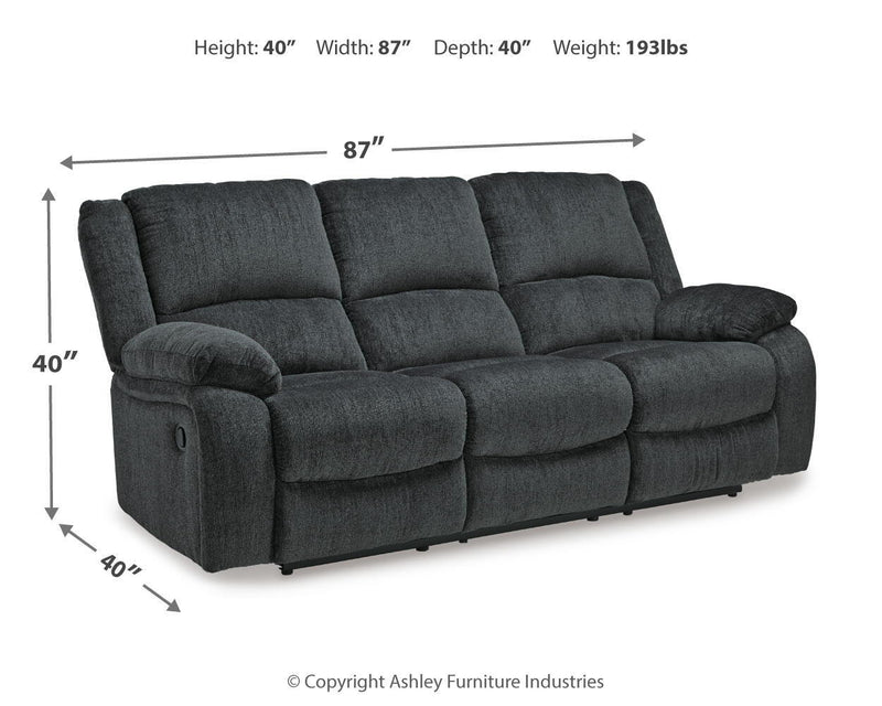 Dark gray reclining sofa with padded arms, three back cushions, 87 in width