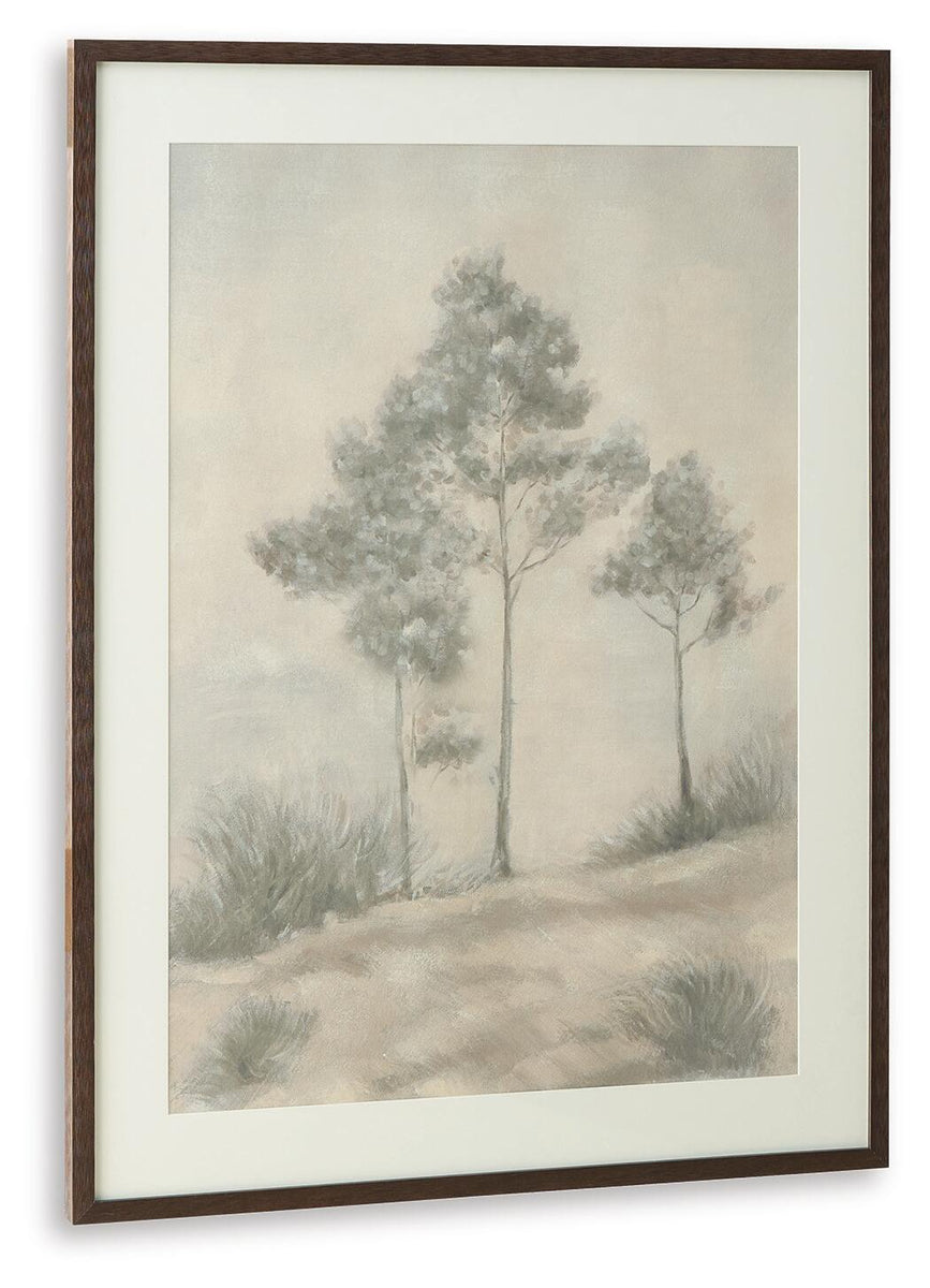 Framed wall art print with three trees, soft beige ground and gray sky
