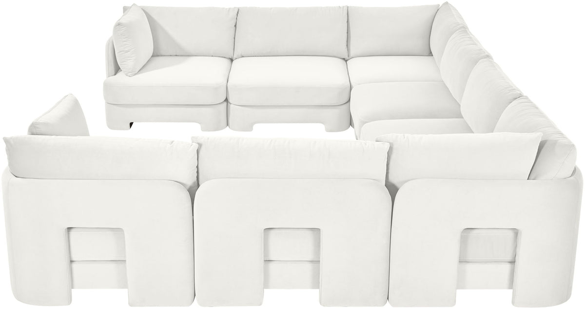 White velvet U-shaped sectional sofa with square cutout detail on front panels