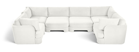White velvet U-shaped sectional sofa with padded seats and matching armrests
