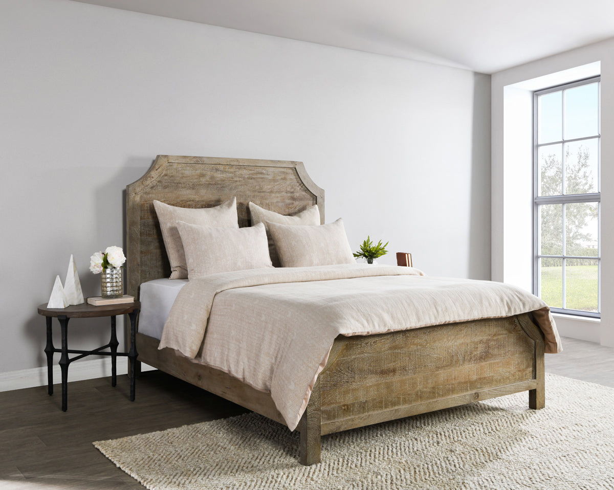 Natural beige French herringbone duvet on a bed with matching pillows