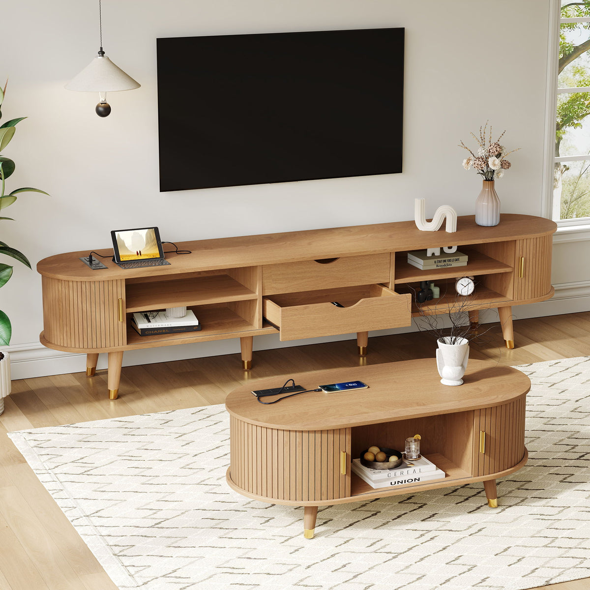 Light wood TV stand with open compartments and drawers, set with round coffee table
